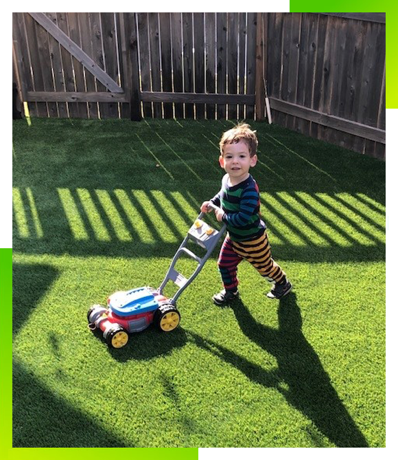 vegas-artificial-grass-kid-playing-lawn-mawer